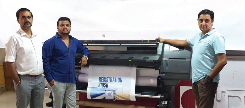 CC Kuttapa, SP Sudarshan and Pawan Sharma, Managing Partners of Pixel 2 Print, alongside an HP Latex 300 Series printer